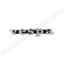 Targhetta anteriore -Vespa- in metallo interasse 59,3mm. per Vespa P125X dal telaio 65161 - P150X dal telaio 436001 - P200E dal 