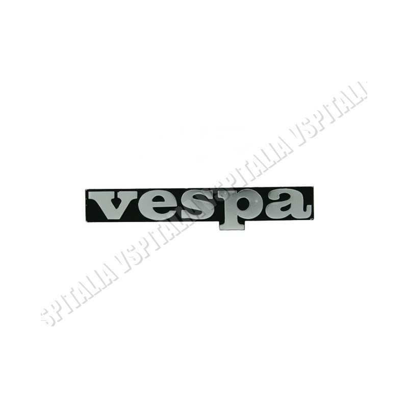 Targhetta anteriore -Vespa- in metallo interasse 59,3mm. per Vespa PK 50/125 senza frecce - PK 50/125 S - PK 50 XL - HP - R.O. P